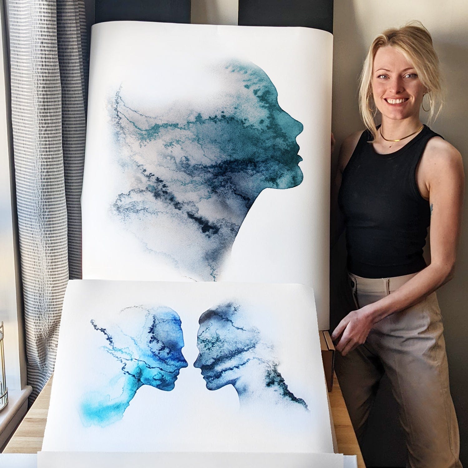 EJayDesign Forget Me Not Limited Edition Print. Scottish Hebridean artist Eilidh Jamieson poses with her watercolour portrait silhouettes