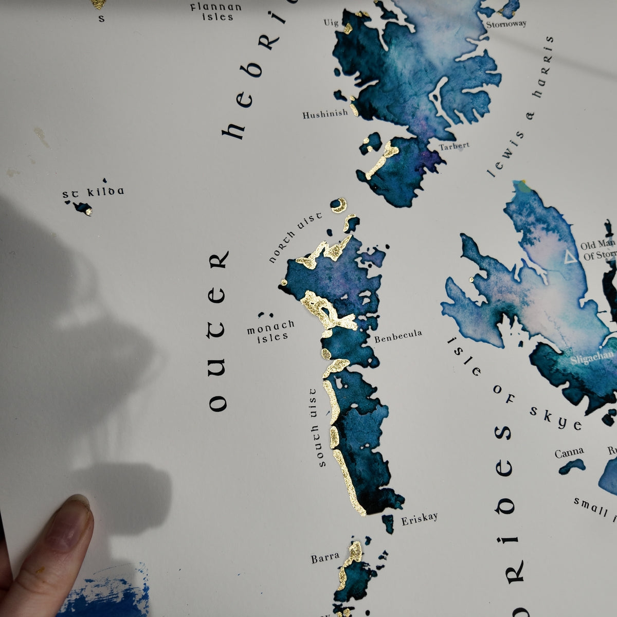 Map of the Outer Hebrides with watercolor style and text labels.