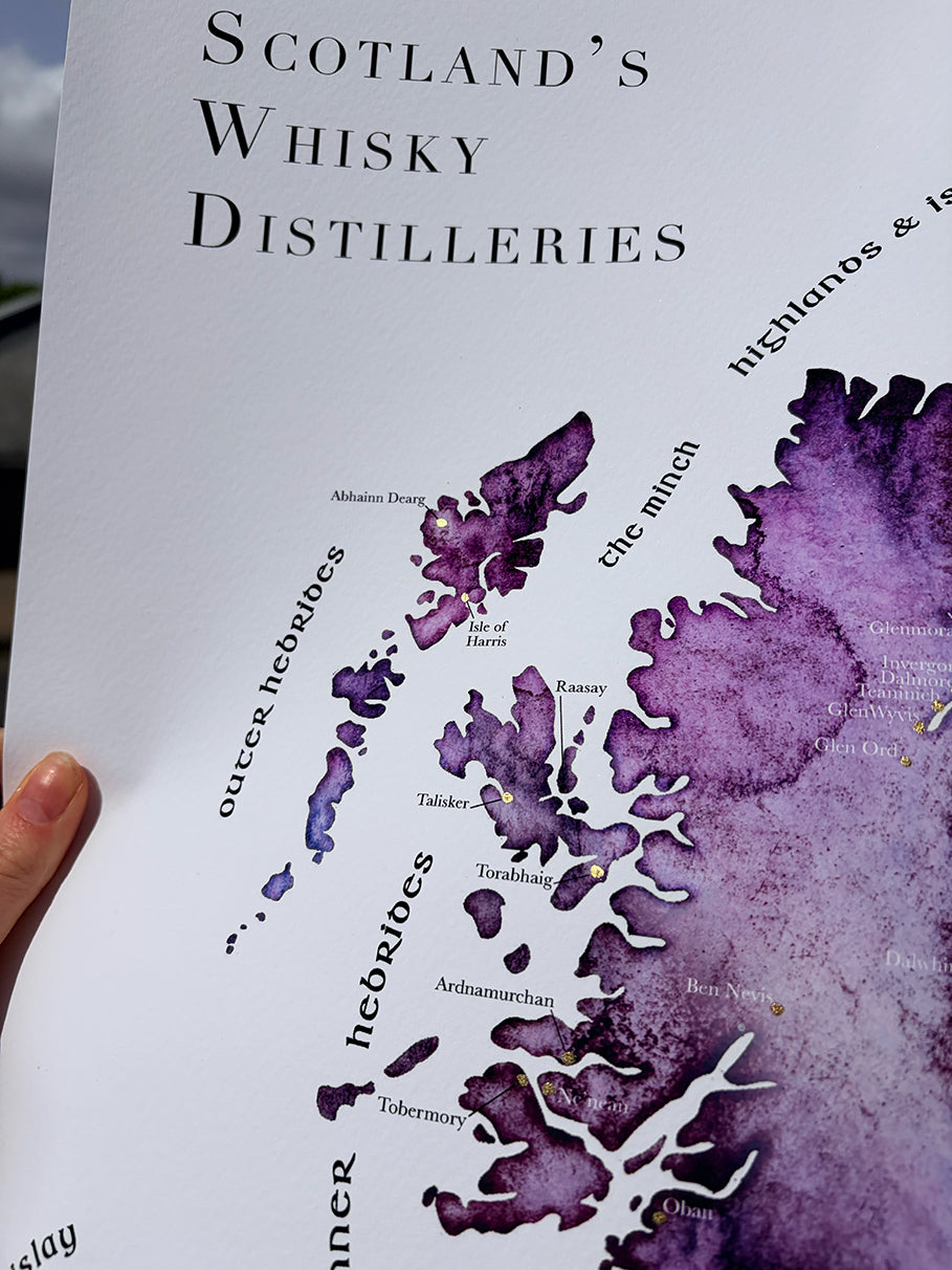 Map of Scotland's whisky distilleries with a purple watercolor design.