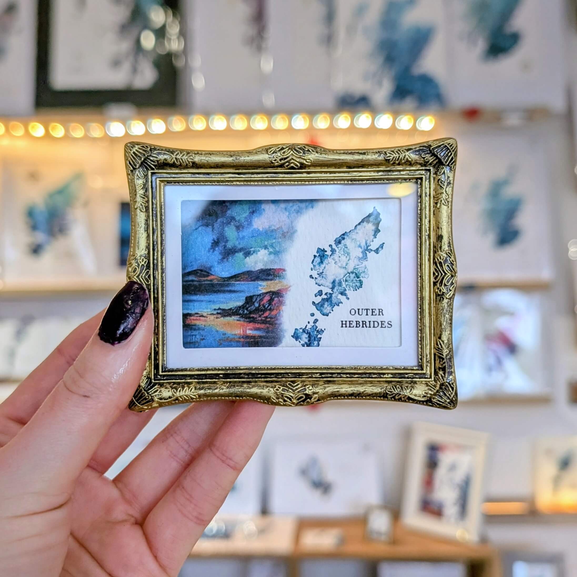gold frame fridge magnet of the outer hebrides with painting by eilidh jamieson scottish artist ejaydesign