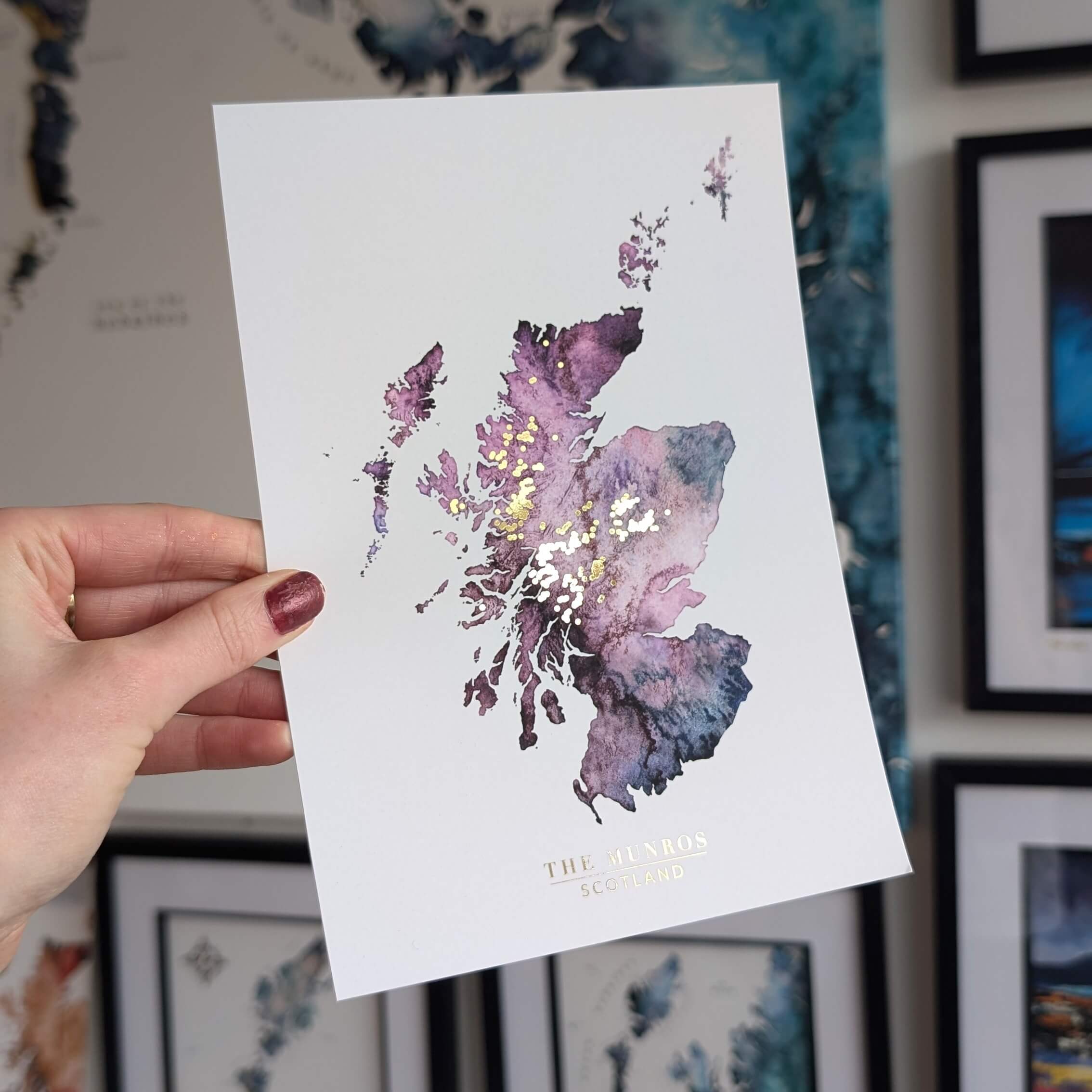 a purple watercolour map of Scotland with all the munro mountains in gold. perfect gift for a munro bagger