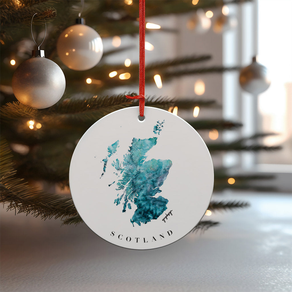 Double-sided MDF Christmas bauble featuring a watercolor map of Scotland with a red ribbon, perfect for festive decoration and art lovers.