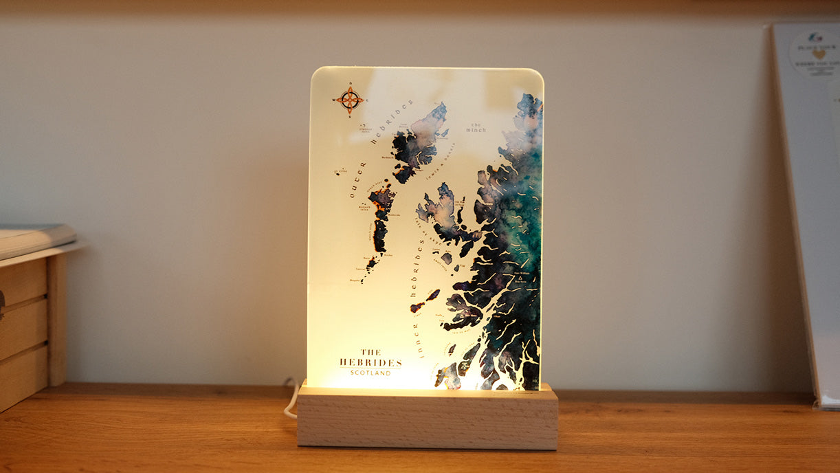 LED art light featuring a watercolor map of Scottish Hebridean islands by ejaydesign, beautifully illuminated to showcase intricate details and add a warm ambiance."