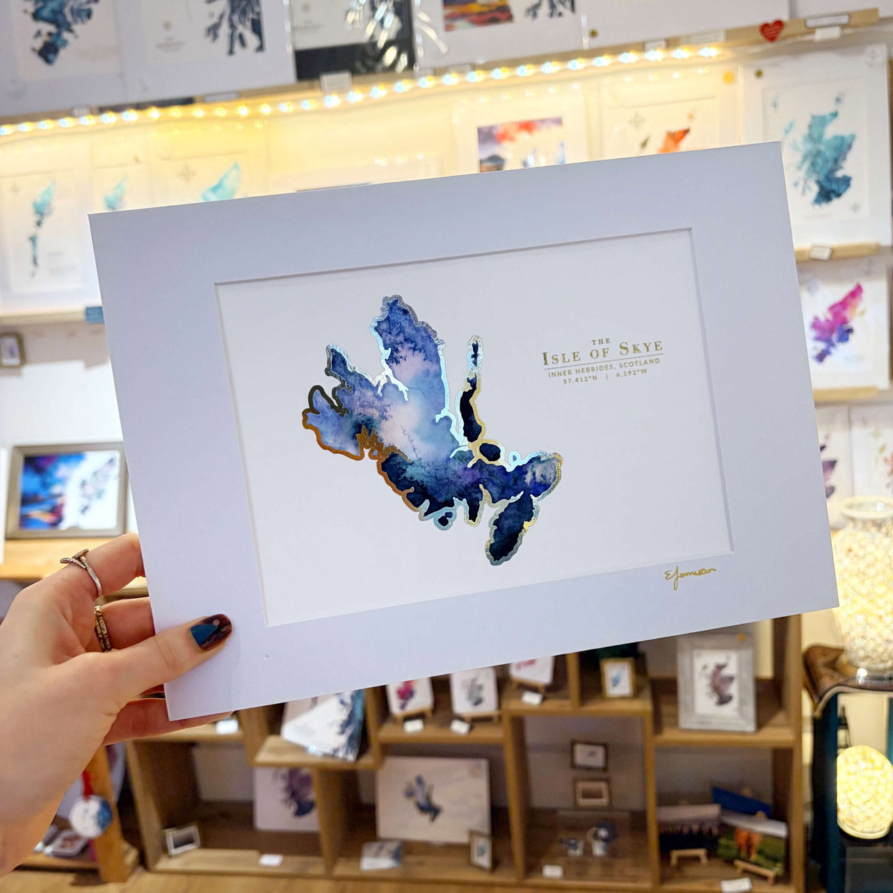 blue watercolour map of the scottish island of skye with a gold foil outline
