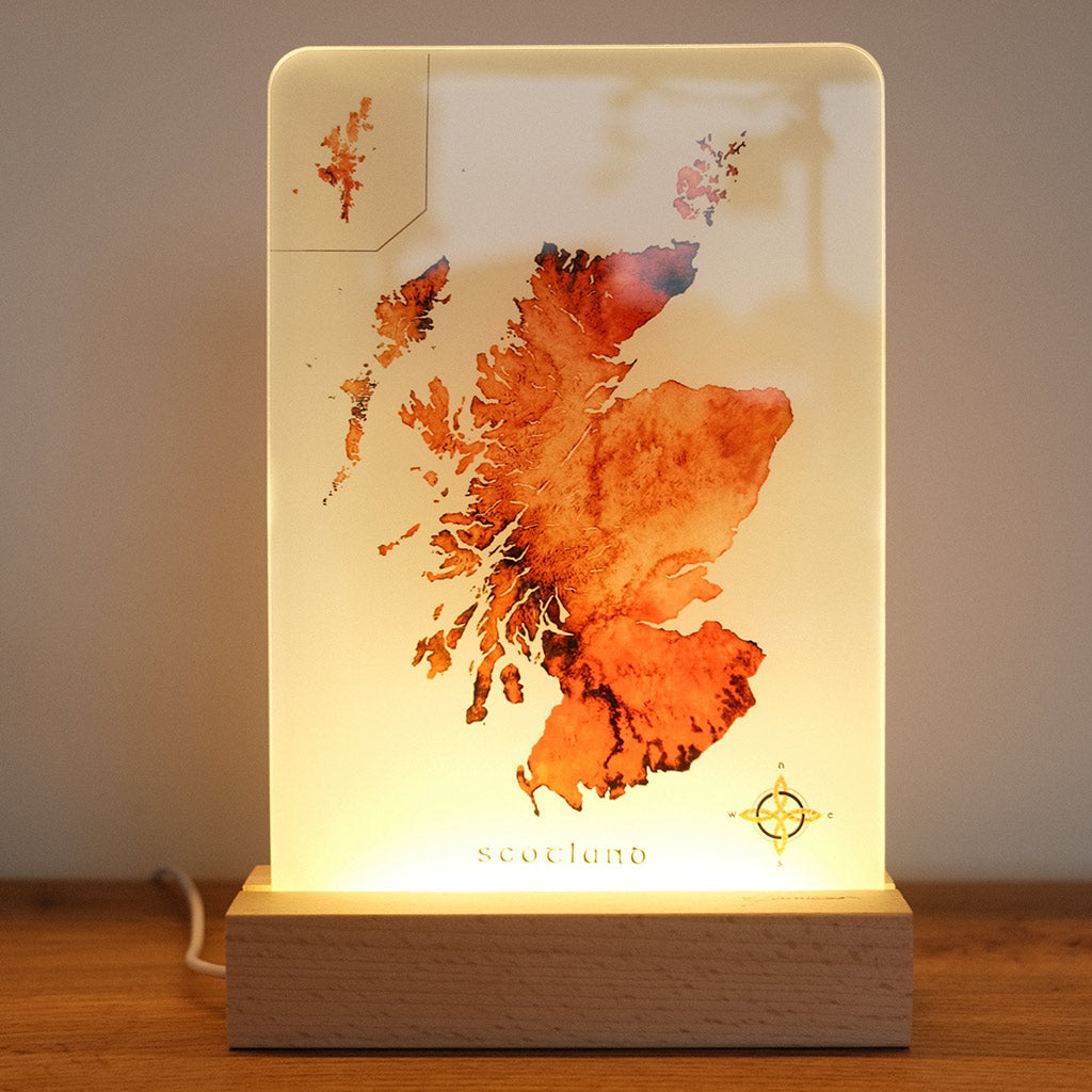 LED art light featuring a watercolor map of Scotland by ejaydesign, beautifully illuminated to showcase intricate details and add a warm ambiance."